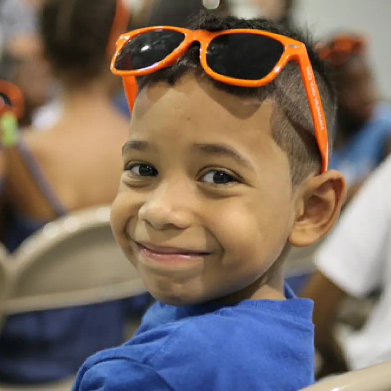 Boy in school with sunglasses